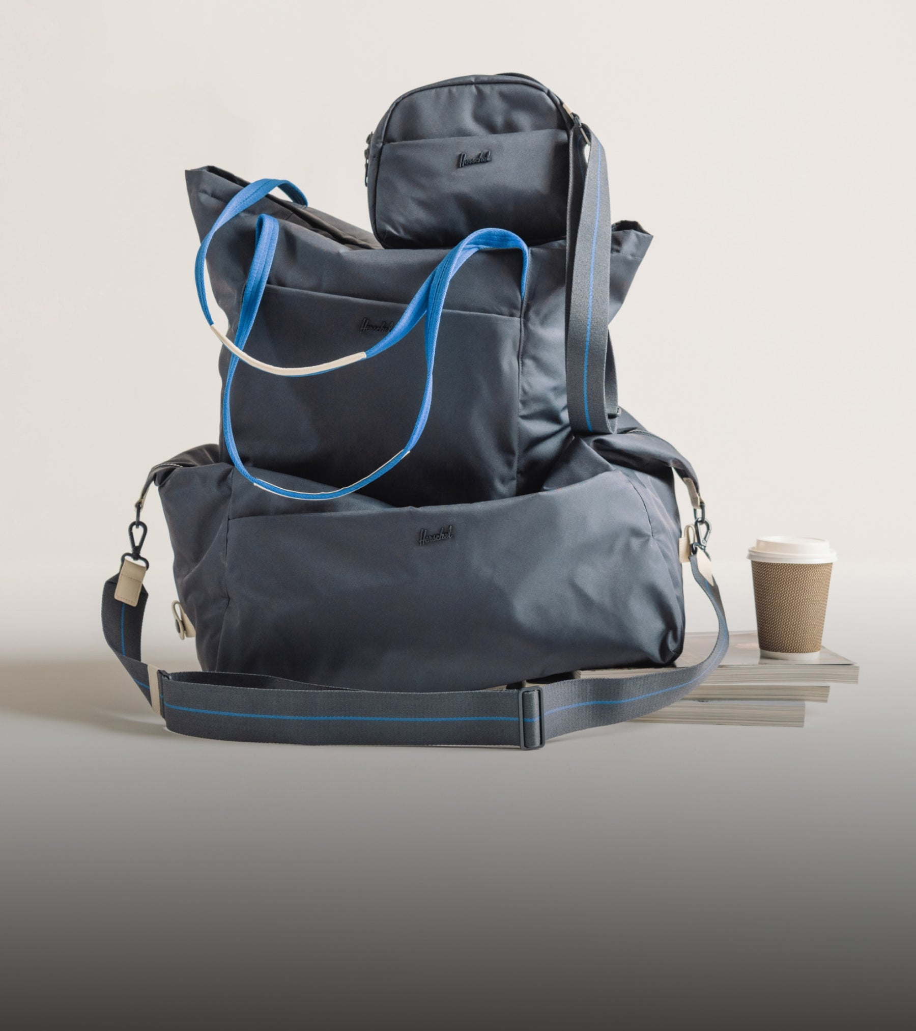 A coordinated collection of everyday bags in graphite blue