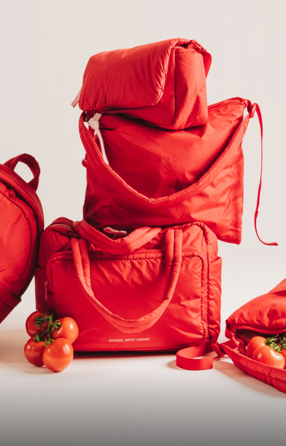A bright red everyday bag styled for a day out
